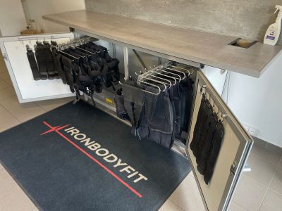 a black mat that has a bunch of clothes on it