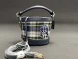 the small bag has a leash attached to it ' s side