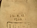 an old bag with a stamp on it sitting on the ground