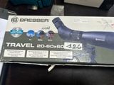 boxed box of a telescope on a table with other items in the background