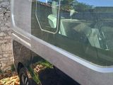 a van that is parked in front of a house