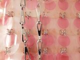 several pairs of scissors sitting on top of a table covered in pink circles