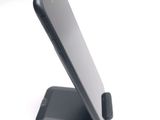 a cell phone that is sitting on top of a stand