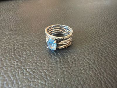 a close up of a ring on a leather surface