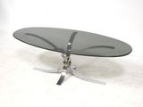 a glass table with a metal base and a glass top
