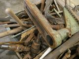 a pile of old rusty tools in a box