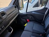 the interior of a car with the door open and the passenger seat down