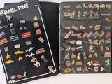 a book with a bunch of pin ' s on it