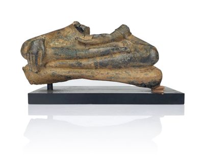 statue of a human foot on a wooden base