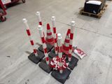 many red and white cones sitting on the ground
