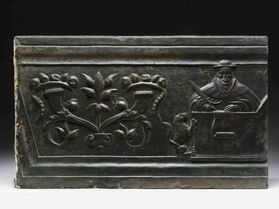 an image of a bronze box with a man and a woman on it