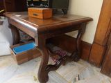 a small wooden table with a box on top of it