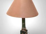 an image of a green lamp with a pink shade on it