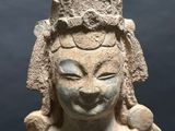 an old statue of a woman with a crown on her head