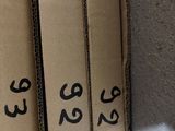 three boxes with numbers on them sitting on a shelf