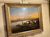 a painting hanging on the wall of a room