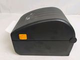 the printer is sitting on a white surface with a white background