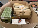 a cardboard box full of boxes and tools in a warehouse