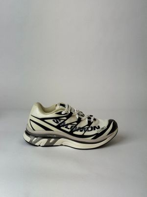 an image of a pair of white and black shoes on a white surface