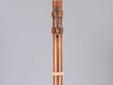 an image of a wooden instrument on a clear surface