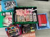 many different types of school supplies in a plastic box