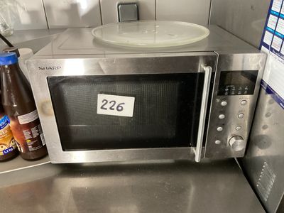 a microwave that is sitting on a counter in a kitchen