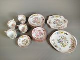 many different types of plates and bowls on the table