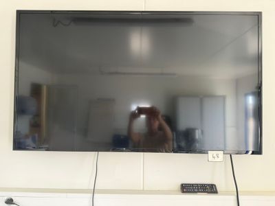 a man taking a picture of himself in the mirror
