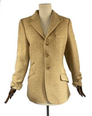 an image of a woman ' s coat on a mannequin