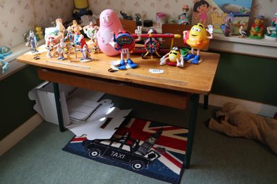 a wooden table with a bunch of toys on top of it