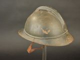 a helmet that is on a stand on a black background
