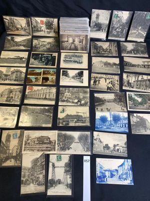 several old black and white postcards are on a table