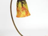 brass table lamp with a marbled glass shade and a chain