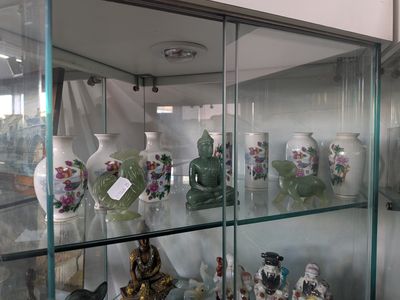 many vases on display in a glass case