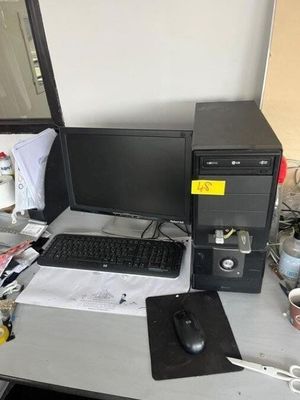 a desktop computer sitting on a desk with a keyboard and mouse