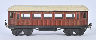un wagon de train miniature posé sur une surface blanche