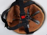 a helmet with a seat belt attached to it