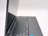 a laptop computer sitting on top of a white table