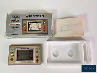 a game and a watch in a box on a table