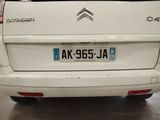 a small white car parked in a garage