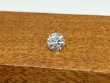 a close up of a diamond sitting on top of a wooden box