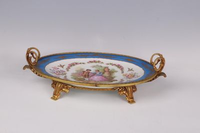 an image of a decorative plate with a lady and child on it