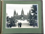 an old photo of a group of people standing in front of a building