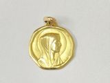 an image of a gold coin with a woman ' s face on it