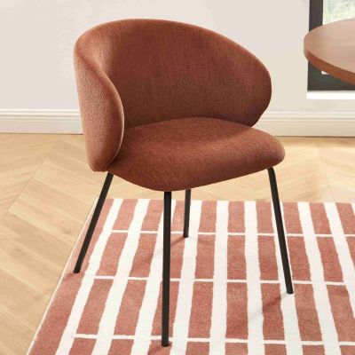 a chair that is sitting on a rug in a room