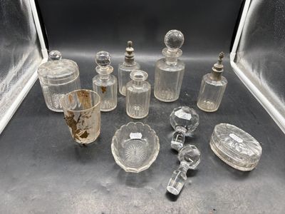 a lot of glass bottles and spoons on a table