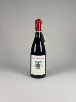 the bottle of wine is sitting on the table ready to be served