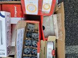 a box of assorted electronics sitting on the ground