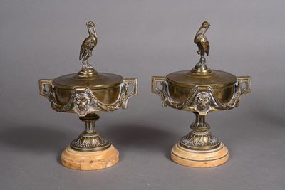 pair of antique brass vases with birds on them on marble bases