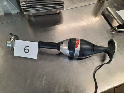 a black and silver blow dryer sitting on a table